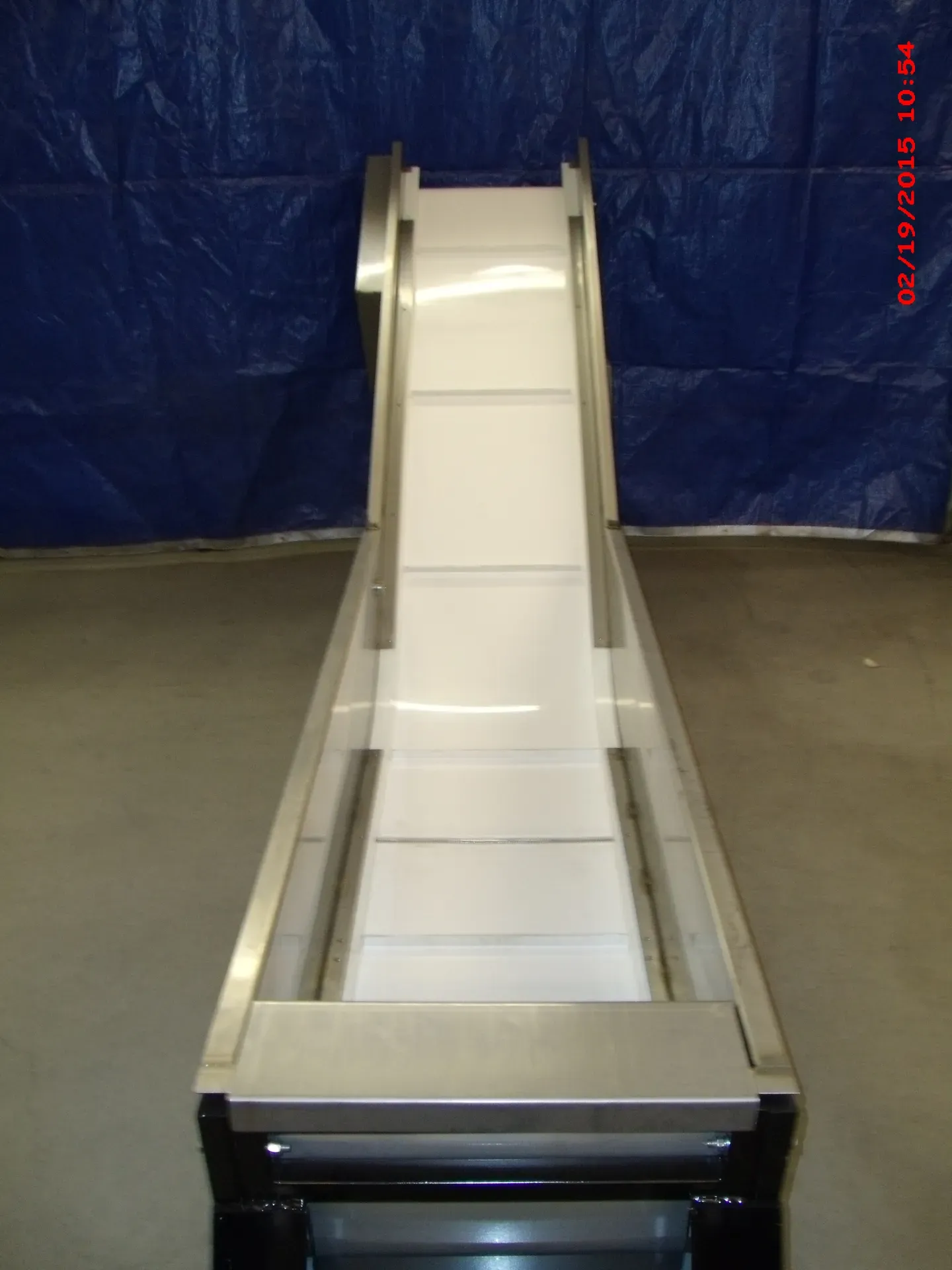 Looking up the incline belt of a LaRos Water-Veyor